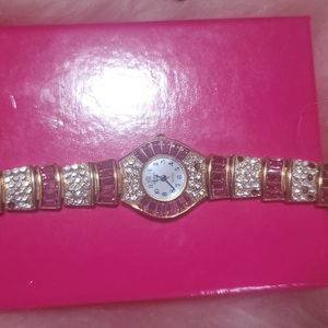gold and pink watch